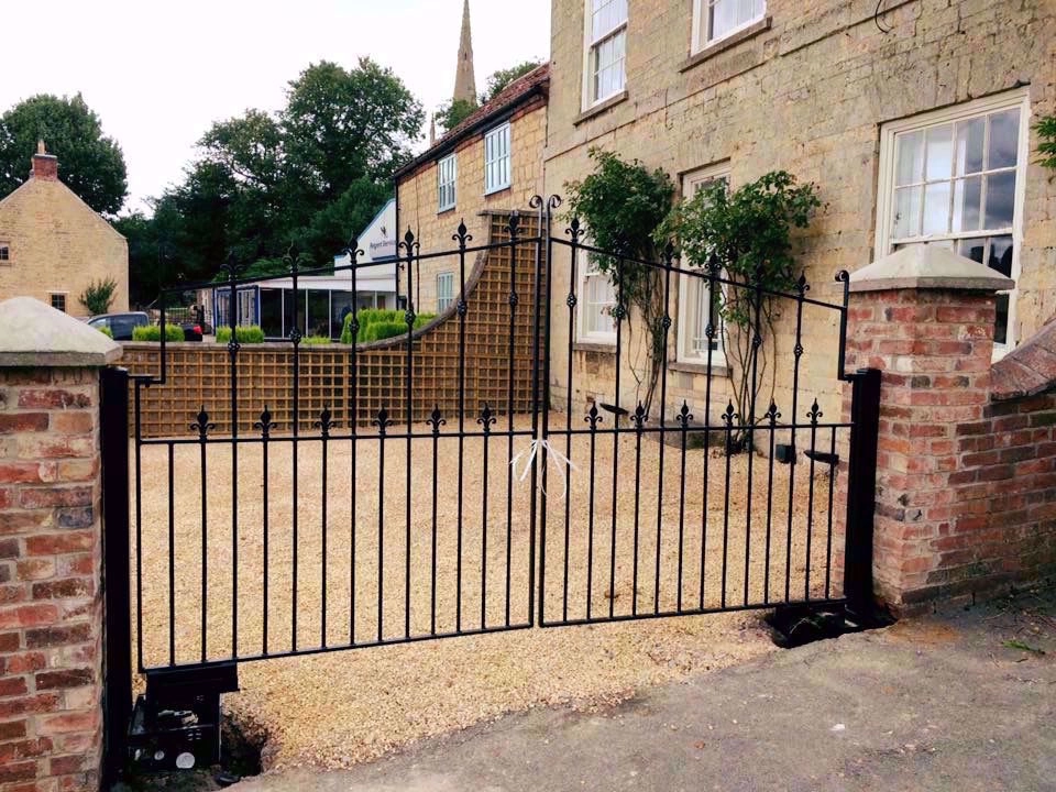 Decorative residential gates installed at property.