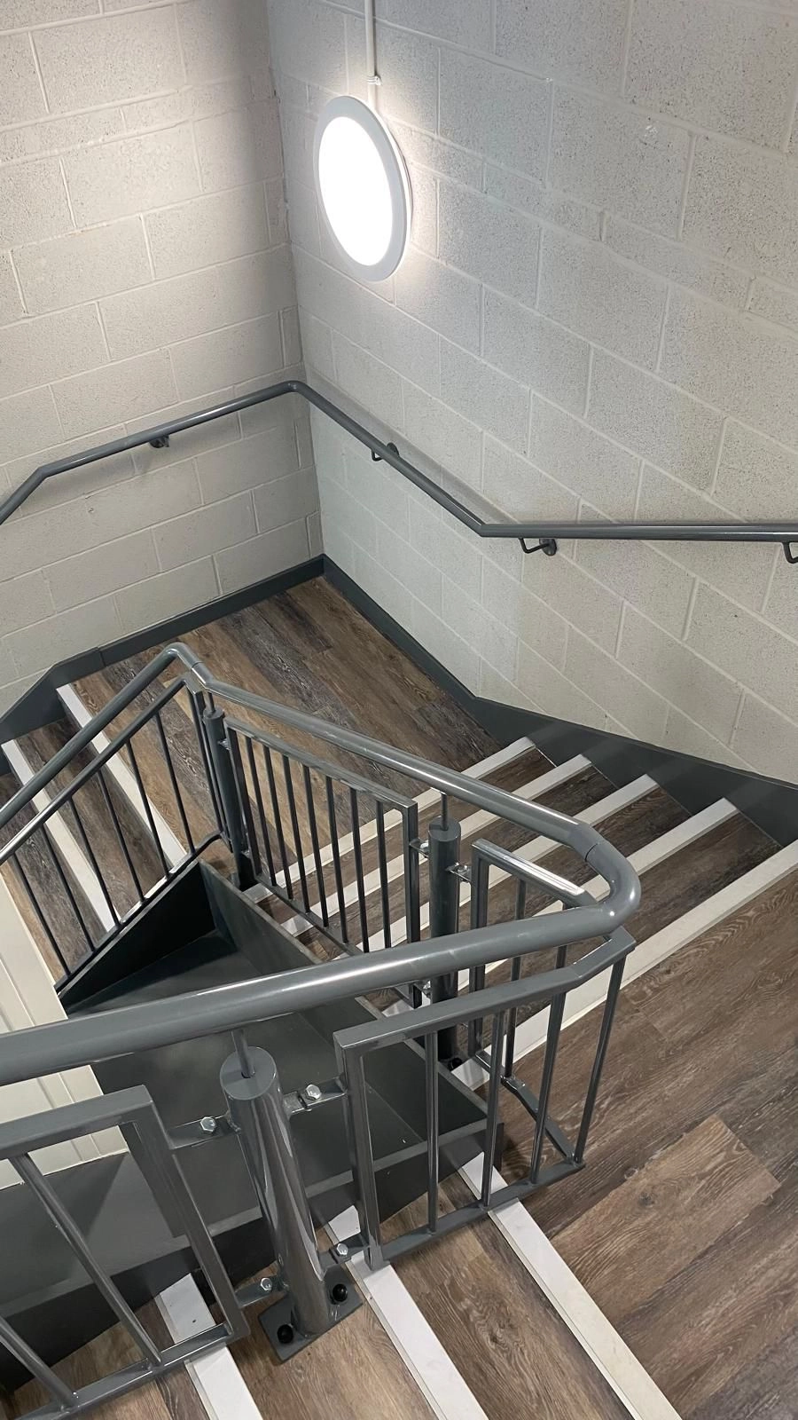 This shows our light gray power coated staircase handrail.
