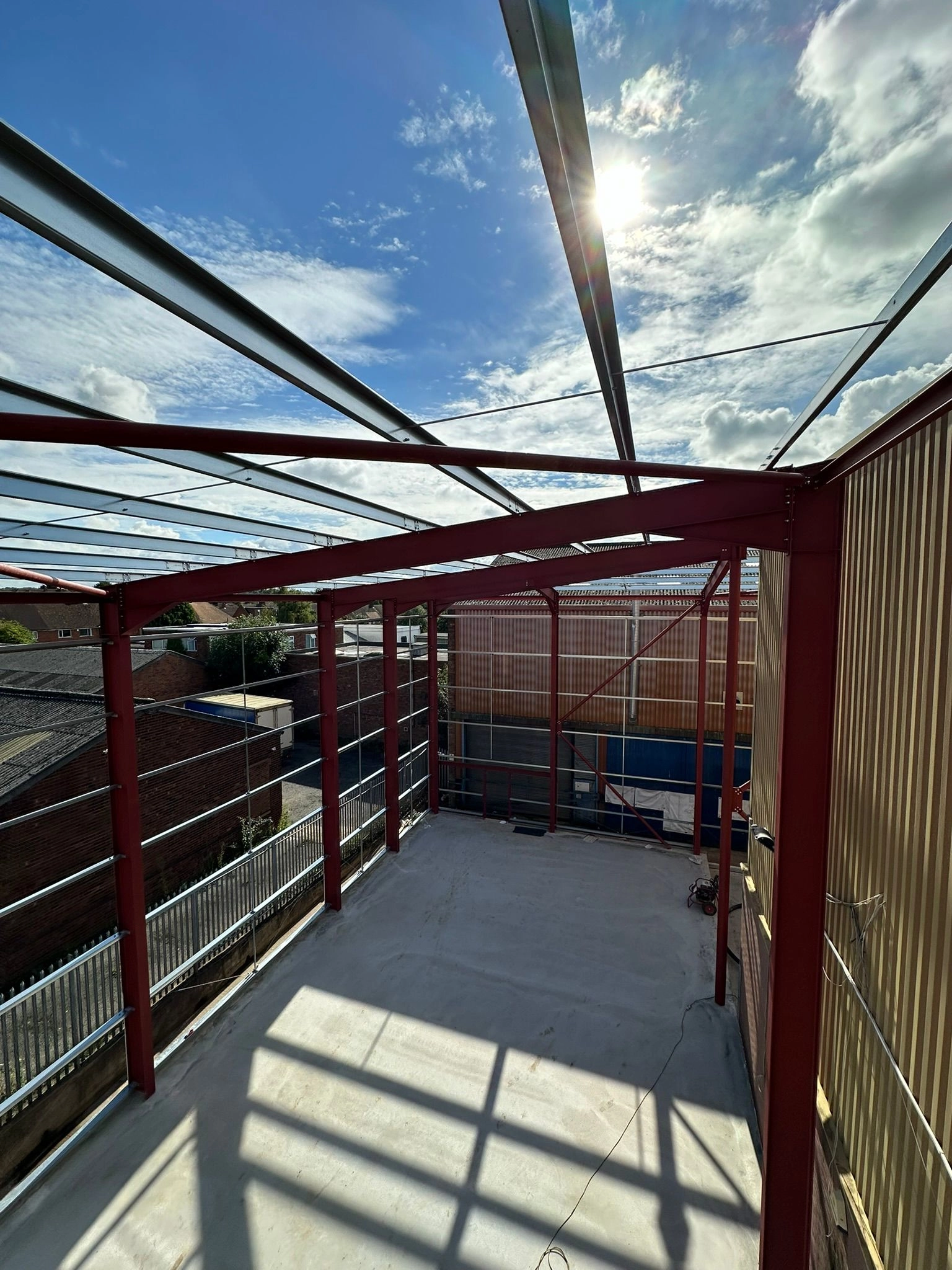 A roof level view showing near Structural completion and a sunny day for a change!  