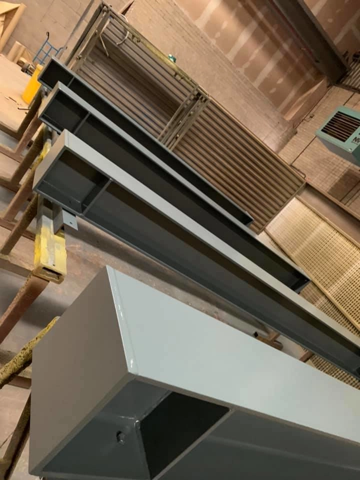 Structural Steel beams laid out after blast cleaning. 